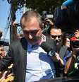 Joesley Batista com o cabelo raspado na saída de um depoimento à Justiça em SP, em agosto   Foto: BBC News Brasil