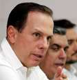 João Doria discursa em uma mesa com empresários  Foto: BBC News Brasil