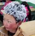 Foto do pequeno Wang, com o cabelo e as sobrancelhas cobertos de neve, viralizou na internet | Foto: People's Daily  Foto: BBC News Brasil