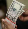 Notas de dólar dos Estados Unidos, fotografados em  Washington, nos EUA
26/03/2015
 REUTERS/Gary Cameron  Foto: Reuters