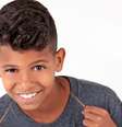 Aos 11 anos, o garoto Richardson Barbosa, agora conhecido como MC Bruninho, viu uma música que escreveu virar hit e ser cantada por Neymar e Gabriel Jesus  Foto: Divulgação / BBC News Brasil