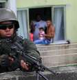 Militar em missão da Cidade de Deus, em fevereiro  Foto: Wilton Junior / Estadão