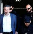 Ex-ministro Antonio Palocci é escoltado por policiais federais em Curitiba  Foto: Reuters