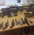 Brigada Militar apreendeu pistolas, revolveres, dois fuzis, uma submetralhadora, munições e coletes à prova de balas  Foto: Brigada Militar/ Divulgação / Estadão Conteúdo
