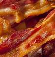 Uma fatia de presunto ou bacon tem cerca de 23 g de carne processada  Foto: Getty Images / BBC News Brasil