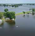 Inundação do rio Mississippi em torno de casas no Missouri  Foto: Getty Images / BBC News Brasil