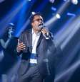 Com repertório focado no pop e no R&B, Tony Gordon conseguiu envolver tanto o público quanto os jurados do 'The Voice Brasil'  Foto: TV Globo/ Divulgação / Estadão