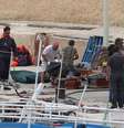 Caixões com corpos de mulheres mortas perto de Lampedusa, no Mediterrâneo  Foto: ANSA / Ansa - Brasil