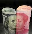Notas de dólar e iuan 
21/01/2016
REUTERS/Jason Lee  Foto: Reuters