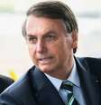 Presidente Jair Bolsonaro cumprimenta turistas na porta do Palácio da Alvorada.  Foto: Antonio Cruz/ Agência Brasil / Estadão Conteúdo