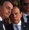 O presidente Jair Bolsonaro e o governador João Doria durante passagem do Comando Militar   Foto: Renato S. Cerqueira / Futura Press