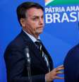 Presidente Jair Bolsonaro caminha ao lado do ministro da Saúde, Nelson Teich, em meio à crise do coronavírus. 16/4/2020. REUTERS/Adriano Machado  Foto: Reuters