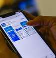 A movimentação da poupança social digital é feita pelo aplicativo Caixa Tem.  Foto: Marcello Casal Jr./Agência Brasil / Estadão