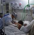 Profissional da saúde trata de paciente com Covid-19 em hospital no Rio de Janeiro (RJ) 
02/07/2020
REUTERS/Ricardo Moraes  Foto: Reuters