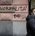Inscrição em parede em Gênova, na Itália, pede volta à "normalidade"  Foto: ANSA / Ansa