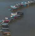 As balsas reviram o leito do rio em busca de ouro  Foto: Reuters / BBC News Brasil