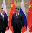 Putin e Xi Jinping durante encontro em Pequim  Foto: Reuters