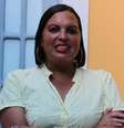 Millena é uma mulher negra. Ela usa argolas douradas, batom vermelho e uma blusa amarela  Foto: Divulgação / Alma Preta
