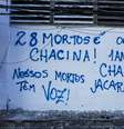 Pixo em muro sobre a operação em Jacarezinho que terminou com 28 mortos, em maio de 2021  Foto: Alexandre Silva / Estadão