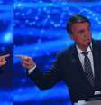 Lula e Bolsonaro lideram as pesquisas e debateram pela primeira vez no domingo  Foto: EPA / BBC News Brasil