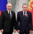 Ravil Maganov com Putin  Foto: Reuters