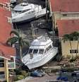 Barcos presos entre casas na Flórida após a passagem do furacão Ian  Foto: Reuters / BBC News Brasil
