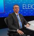 Bolsonaro na sabatina no 'JN': logomarca sem o '2022' que poderia indicar o número do presidente  Foto: Reprodução