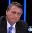 Bolsonaro na tela da Globo, em agosto, no 'JN': demorou, mas assinou em benefício do canal  Foto: Reprodução
