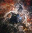 A Nebulosa da Tarântula, localizada a apenas 161 mil anos-luz da Terra, é um lugar onde nascem milhares de estrelas  Foto: NASA/ESA/CSA/STScI/Webb ERO Production Team / BBC News Brasil