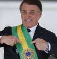 Jair Bolsonaro (PL) com a faixa presidencial; presidente não passará a faixa para Luiz Inácio Lula da Silva (PT)  Foto: Agência Brasil