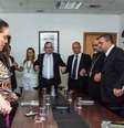 Carla Costa, à esquerda, reza ao lado de diretores da Funai, do presidente Marcelo Xavier, e de Padre Kelmon, na sala da Funai, em outubro de 2022  Foto: Redação / Estadão