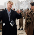 Christopher Nolan e Fionn Whitehead em cena de Dunkirk.  Foto: Adoro Cinema
