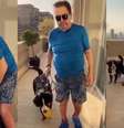 Faustão na sacada da cobertura com um de seus cães: rotina tranquila longe da badalação dos famosos  Foto: Reprodução