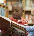 Garoto negro e garota branca em biblioteca  Foto: Getty Images / BBC News Brasil