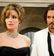 Angelina Jolie e Johnny Depp em cena de O Turista.  Foto: Adoro Cinema