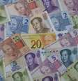 Notas de yuan chinês e de real brasileiro   Foto: iStock
