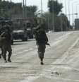 Exército israelense remove corpos do kibbutz Kfar Aza  Foto: EPA / Ansa - Brasil