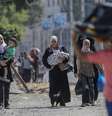 Palestinos fugindo de guerra  Foto: EPA / Ansa - Brasil