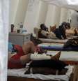 Foto mostra feridos sendo tratados na tenda montada no pátio do Hospital Shuhada al-Aqsa, em 17 de outubro de 2023  Foto: Majdi Fathi via Reuters Connect