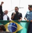 O presidente Lula, ao lado de Guilherme Boulos e do futuro ministro Fernando Haddad, durante as eleições de 2022  Foto: REUTERS/Carla Carniel