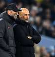  Foto: Oli Scarff/AFP via Getty Images - Legenda: Klopp e Guardiola travaram grandes duelos ao longo dos últimos anos / Jogada10