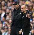 Klopp e Guardiola em um Manchester City x Liverpool   Foto: Michael Regan | Getty Images / Esporte News Mundo