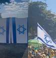 Bandeiras de Israel sendo vendidas durante ato pró-Bolsonaro em Copacabana  Foto: Hugo Henud/Terra/Reprodução/Redes Sociais