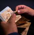 Serão pagos R$ 4,45 bilhões nessa fase para 4,4 milhões de pessoas.  Foto: Marcello Casal Jr/Agência Brasil / Estadão