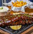 Costelinha Suína com molho barbecue  Foto: Elvis Fernandes/ Divulgação / Estadão
