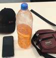 Homem foi preso com um celular, uma garrafa com gasolina e um isqueiro  Foto: Divulgação/SSP