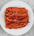 Bacon pode aumentar o risco de doenças cardíacas e câncer  Foto: Shutterstock / Alto Astral