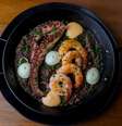 Como típico restaurante-bar espanhol, o menu do Sancho Bar y Tapas tem uma parte só dedicada às paellas e arrozes  Foto: Bia Fortes/Divulgação / Estadão
