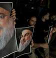 Apoiadores do líder do Hezbollah, Hassan Nasrallah, carregam suas fotografias enquanto se reúnem em Sidon, no Líbano, após sua morte.  Foto: Reuters / BBC News Brasil