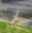 Vista aérea feita por helicóptero mostra cratera aberta após explosão de bomba da 2ª Guerra Mundial no Aeroporto de Miyazaki no Japão  Foto: Kyodo via Reuters